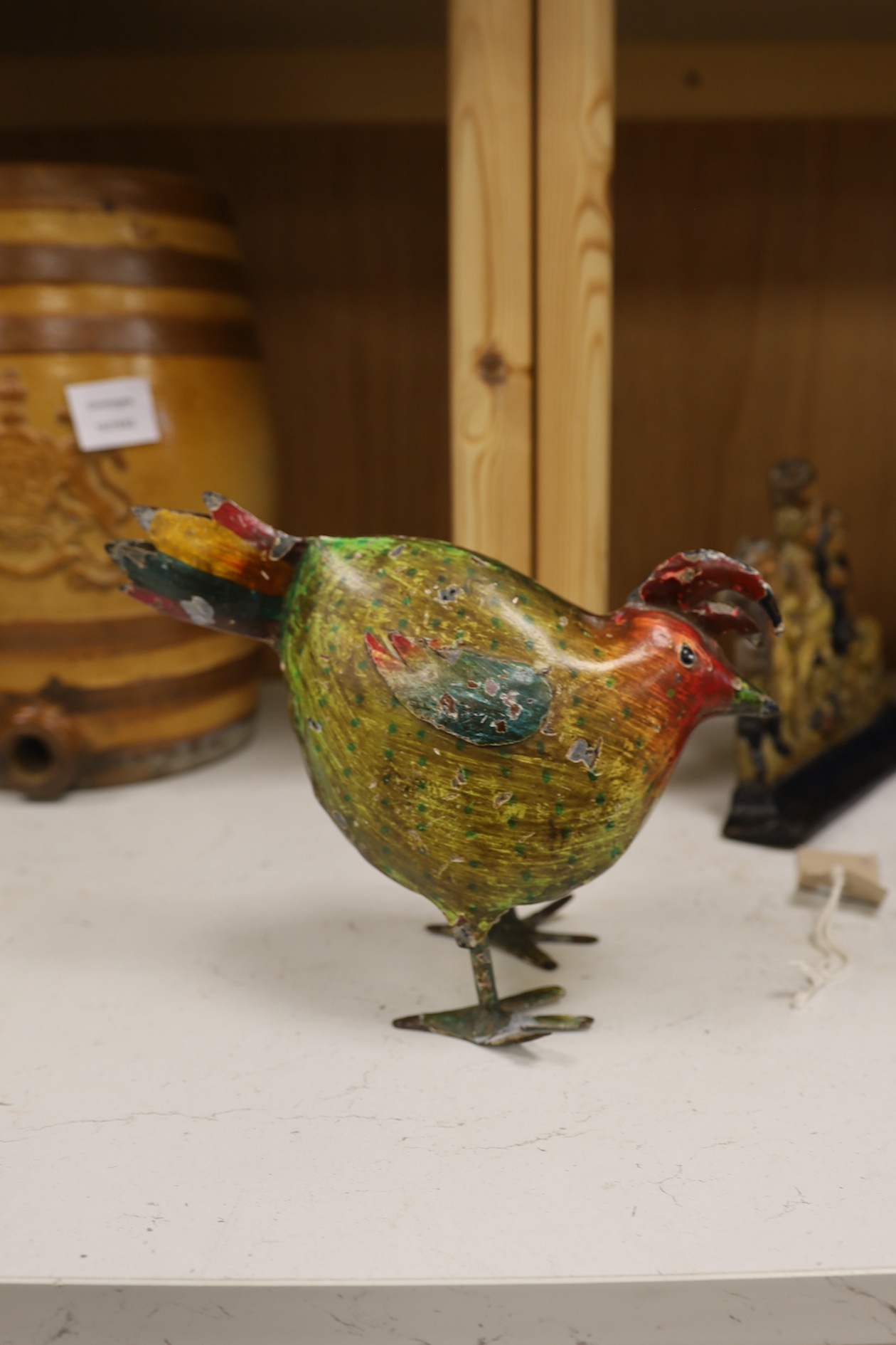 A painted ply Noah's Ark with animals, two Victorian iron door stops, a painted toleware cockerel and an oil on canvas of a harbour view. Condition - varies